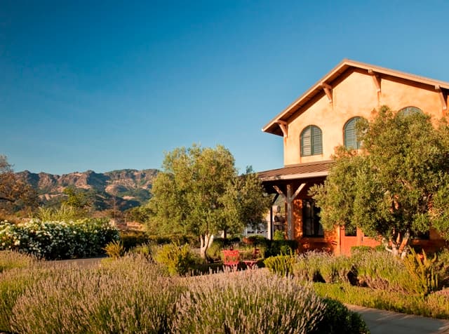 The Tuscan-style Envy winery building with lavender